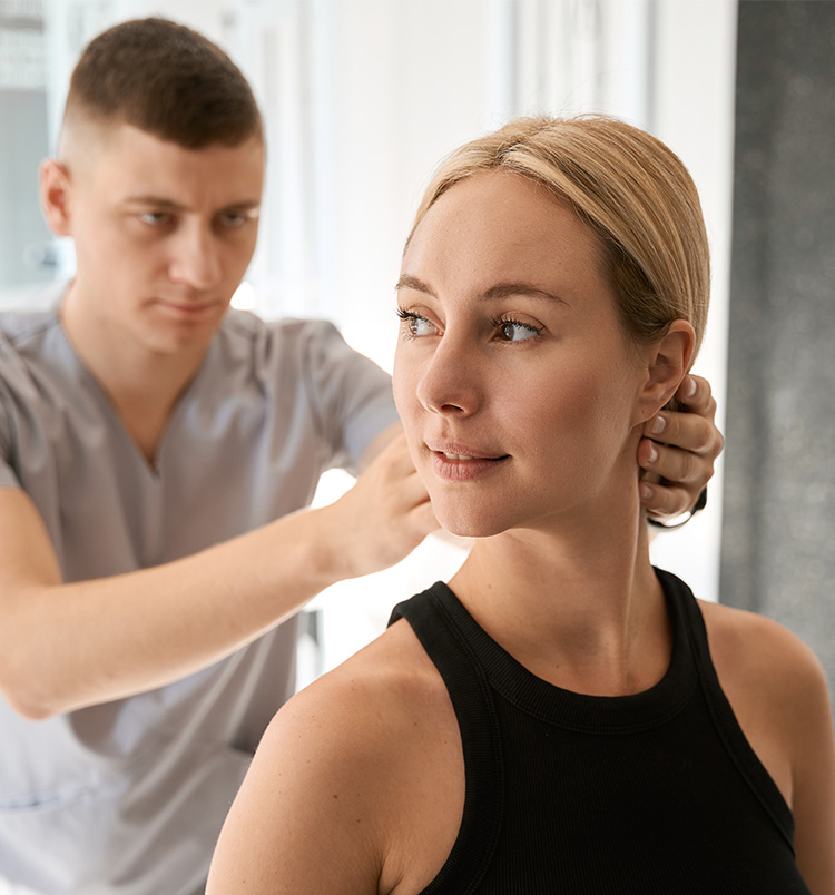 male-chiropractor-working-with-a-young-client